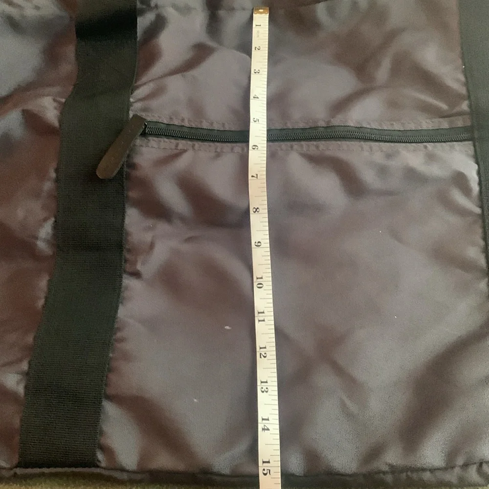 Dark gray and black nylon duffel bag. Approximately 27” x 15” x 11 1/2”